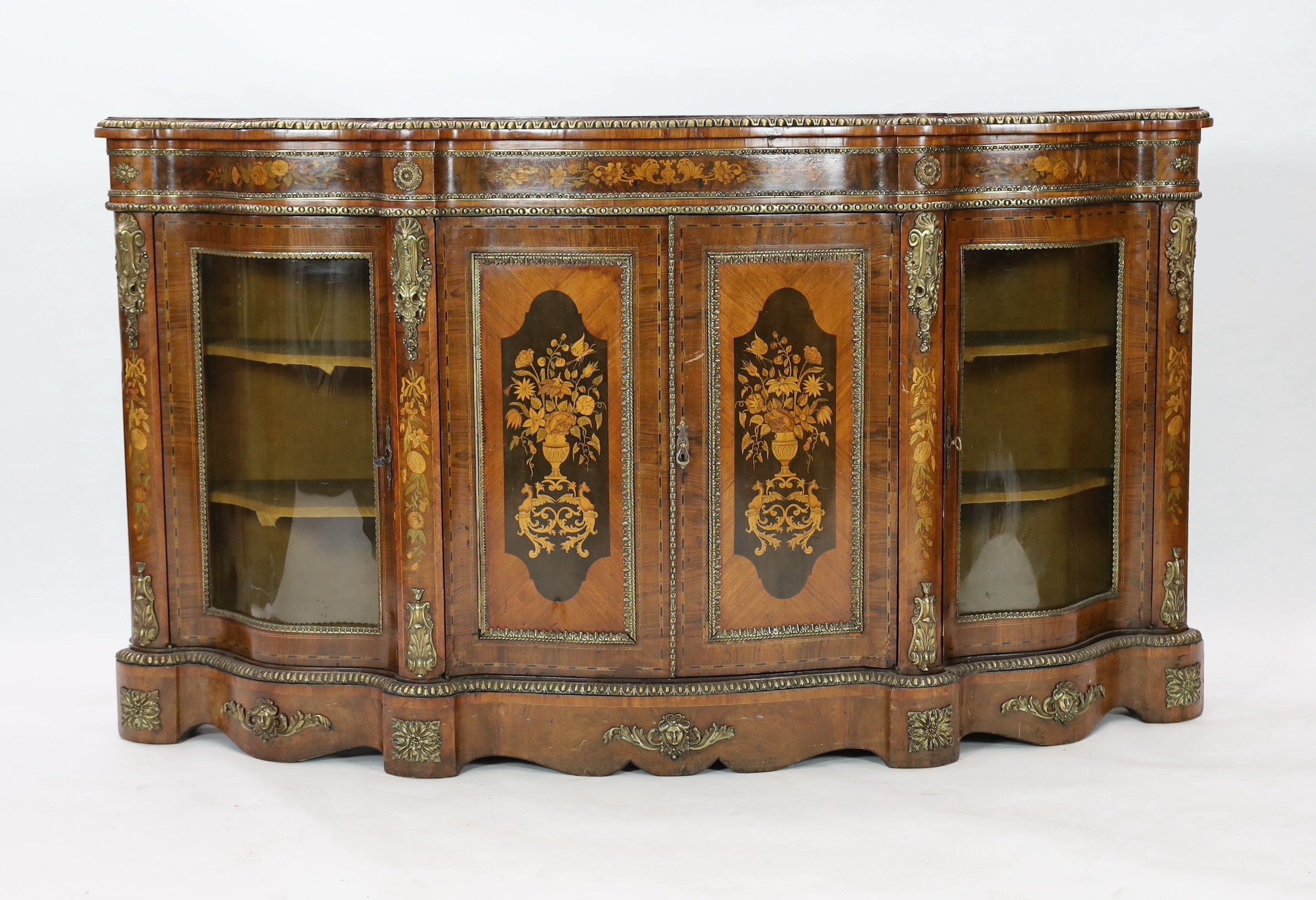 A Victorian marquetry inlaid walnut serpentine credenza, W.201cm D.48cm H.113.5cm